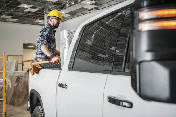 istock Contractor Sitting in Pickup Trunk at Construction Site 1782355608