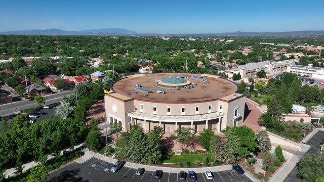 New Mexico state capitol building. Aerial orbit around round government building in downtown Santa Fe, NM.