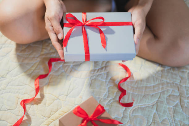 istock Woman giving a christmas or birthday gift 1782389732