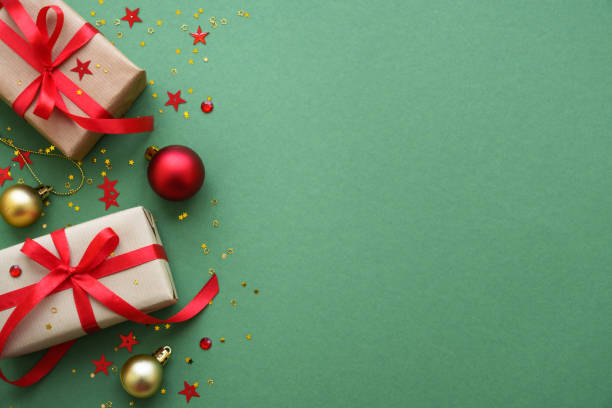 istock Christmas Present and red decorations at color background. 1782400712
