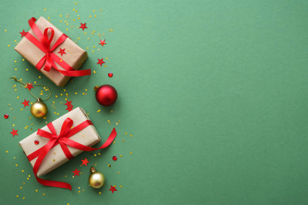 istock Christmas Present and red decorations at color background. 1782400717