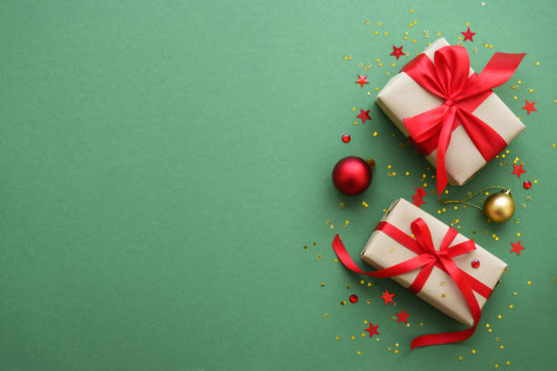 istock Christmas Present and red decorations at color background. 1782400738