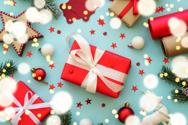 istock Christmas Present and red decorations at color background. 1782401253