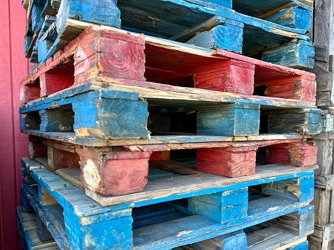 Close-up old wooden pallets.Wood pallet in factory area use for carry material and product supply to customers.Selective focus