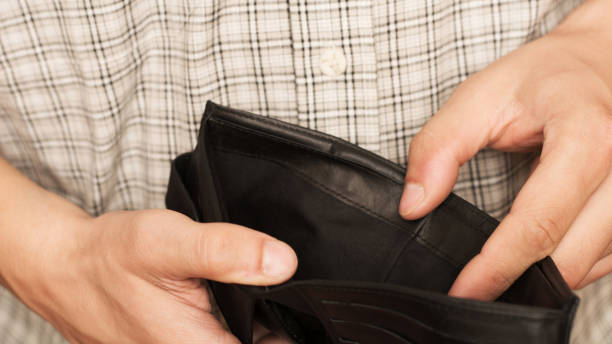 istock Close-up of hands opens an empty wallet. Shopping before Christmas. 1782443884