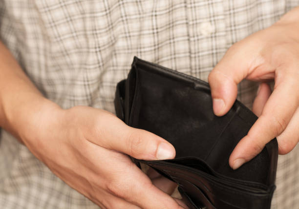 istock Close-up of hands opens an empty wallet. Shopping before Christmas. 1782444129
