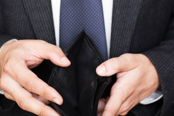 istock Close-up of hands opens an empty wallet. Shopping before Christmas. 1782444145
