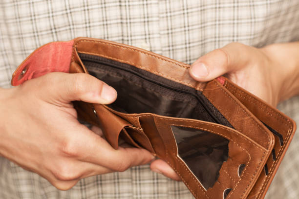istock Close-up of hands opens an empty wallet. Shopping before Christmas. 1782444151