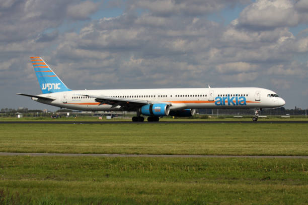 Vijfhuizen, Netherlands - August 19, 2011: Arkia Israeli Airlines Boeing 757-300 with registration 4X-BAW just landed on runway 18R (Polderbaan) of Amsterdam Airport Schiphol.