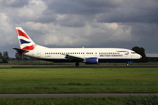 Vijfhuizen, Netherlands - August 28, 2011: British Airways Boeing 737-400 with registration G-DOCO just landed on runway 18R (Polderbaan) of Amsterdam Airport Schiphol.