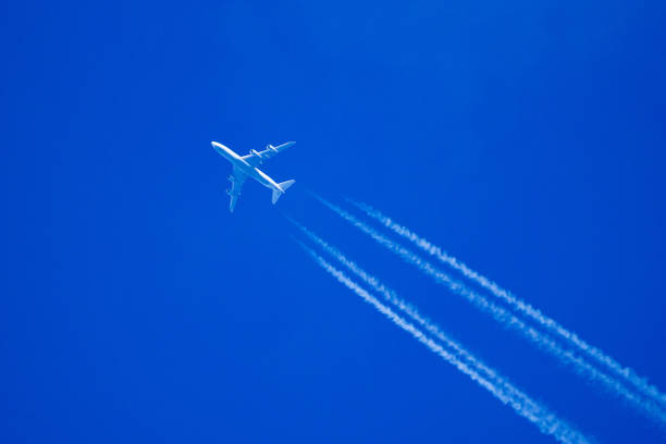 istock Four engine passenger jet at high altitude leaving contrails behind it 1782490995