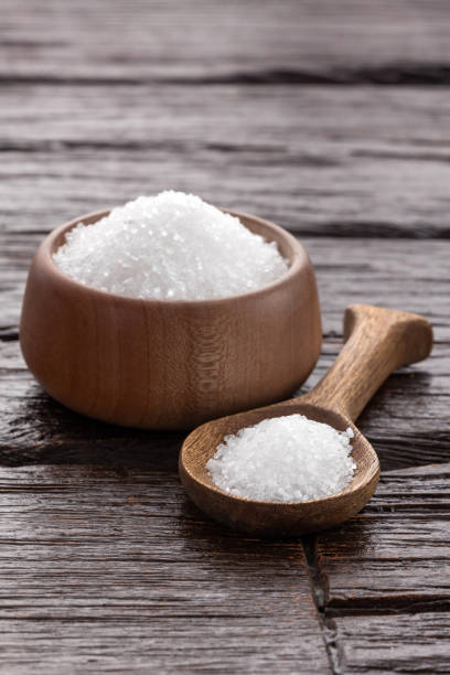 istock Magnesium chloride in wooden spoon and bowl - chemical component 1782509381