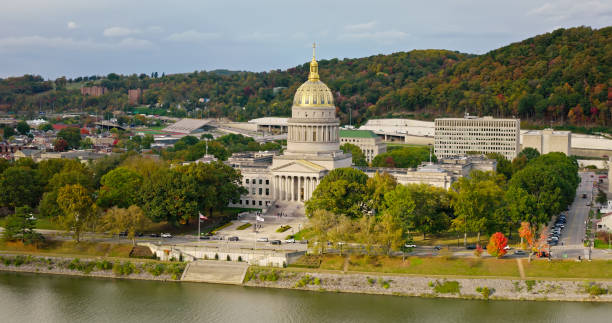 West Virginia State Capitol Building on Cloudy Day - Aerial Shot A high angle aerial still photo of the West Virginia State Capitol building on a cloudy day. west virginia us state stock pictures, royalty-free photos & images