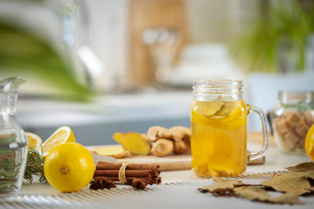 istock Ginger and lemon infused water in a Mason jar on kitchen counter 1782517528
