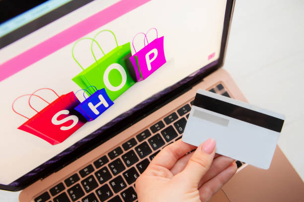 istock female hand holds a black plastic bank card 1782520976
