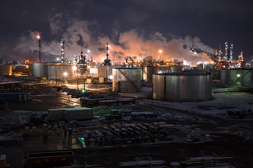 High angle view of a chemical plant in Commerce City, Colorado, on a snowy evening in fall.