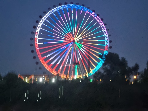 Niagara Falls lit at night by colorful lights