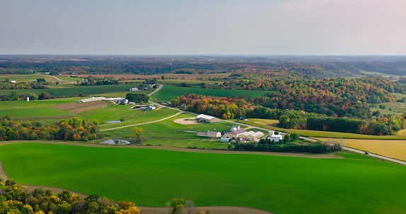 An aerial still photo of luscious fields and greenery in Hillsboro, Wisconsin, on an overcast, fall day.