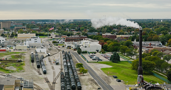 Drone shot of oil train cars at a chemical plant in Wyandotte, a small city south of Detroit in Wayne County, Michigan on an overcast day in Fall.