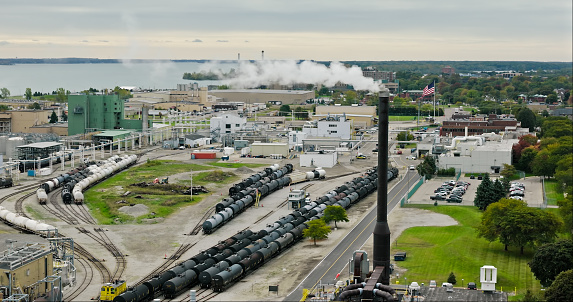 Drone shot of oil train cars at a chemical plant in Wyandotte, a small city south of Detroit in Wayne County, Michigan on an overcast day in Fall.