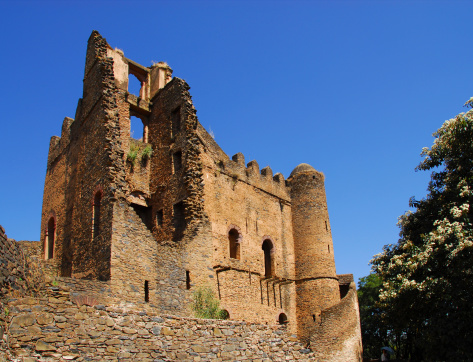 Palace of Iyasu, the greatest ruler of the Gonderine period. Architecture influenced by the Portuguese advisers sent from Goa. Built within the walled imperial enclosure. Fasil Ghebbi, Gondar / Gonder, Ethiopia. Gondar was the capital of Ethiopia from 1632 to 1855. Plenty of Copy space for text.