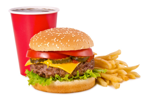 Cheeseburger, french fries and cola on a white background. Front view.