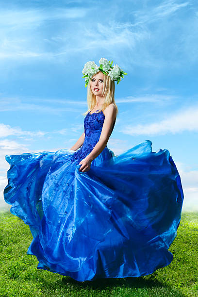 Fit blonde walking at sumer evening meadow