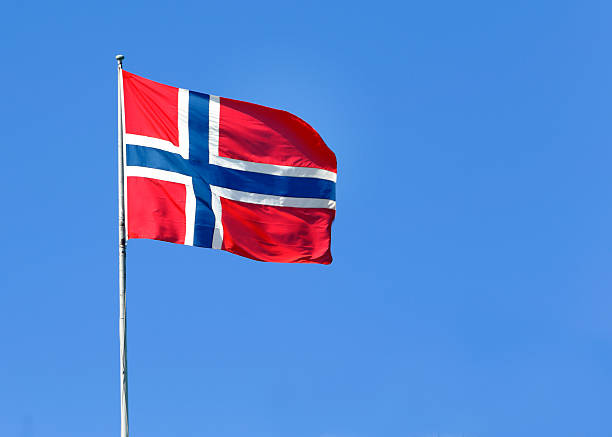 Norwegian flag The Norwegian flag flies in the wind. norwegian flag stock pictures, royalty-free photos & images