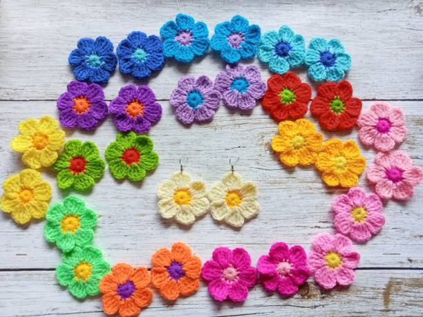 istock Crochet earring flowers handmade in multicolour background texture 1782706282