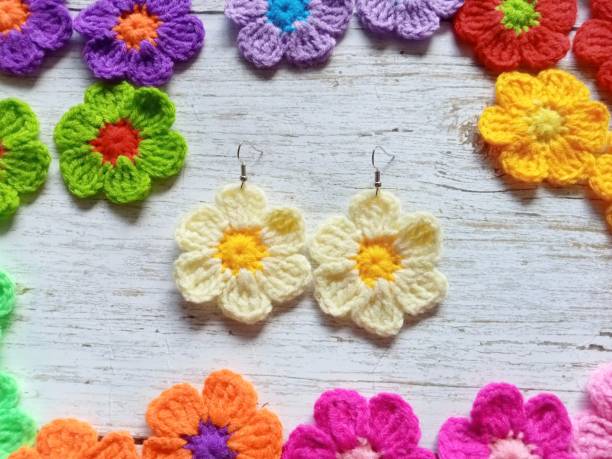 istock Crochet earring flowers handmade in multicolour background texture 1782706290