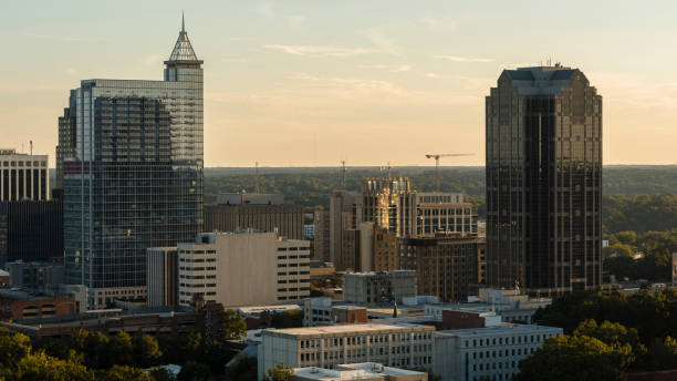 istock Urban development and building activity in Raleigh, NC. Glazed skyscrapers and gantry cranes towers above the Financial District of Raleigh in North Carolina 1782741709
