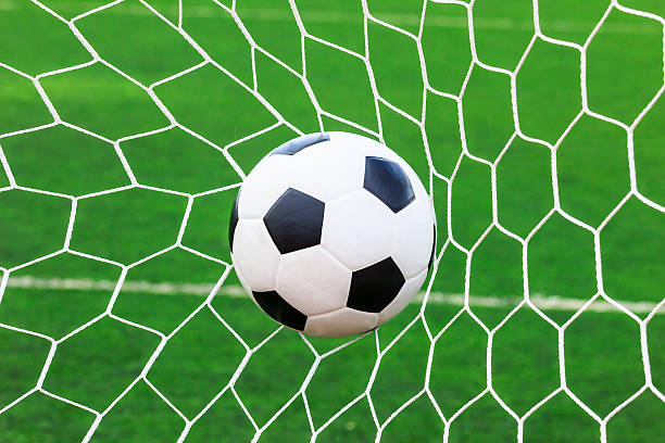 istock soccer ball in goal net 178274267