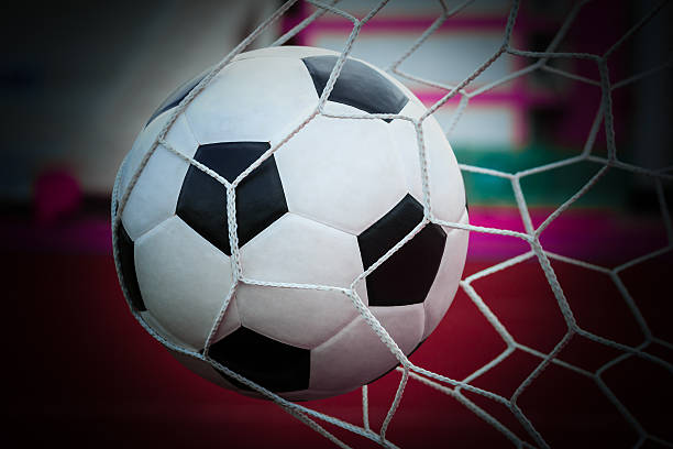 istock soccer ball in goal net 178274650
