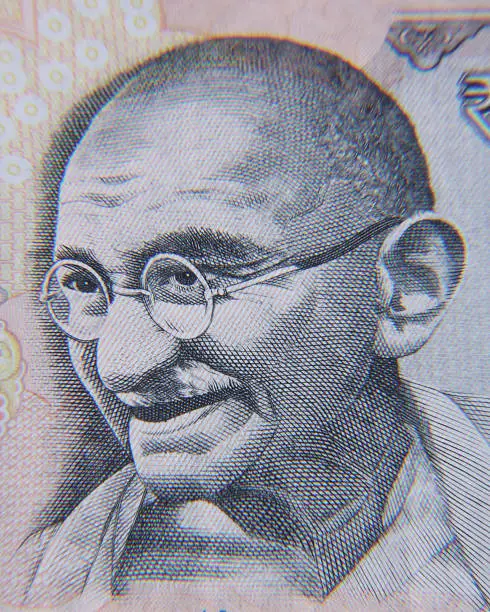 Photo of Gandhi depicted in Indian currency in black and white