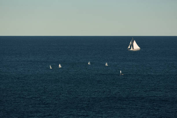 monaco, lonely vintage sail yacht in sea at sunset, huge sail boat, wealth life of billionaires - sailing light wind nautical vessel imagens e fotografias de stock