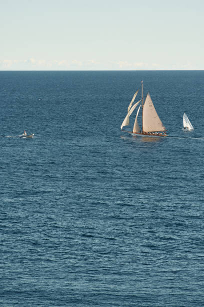 monaco, lonely vintage sail yacht in sea at sunset, huge sail boat, wealth life of billionaires - sailing light wind nautical vessel imagens e fotografias de stock