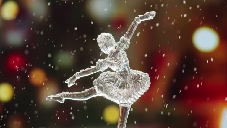 Christmas new year background, vibes of winter holiday, Glass ballerina and santa claus dear near Christmas tree indoors. Gifts and presents for childs. Snow and decorations.