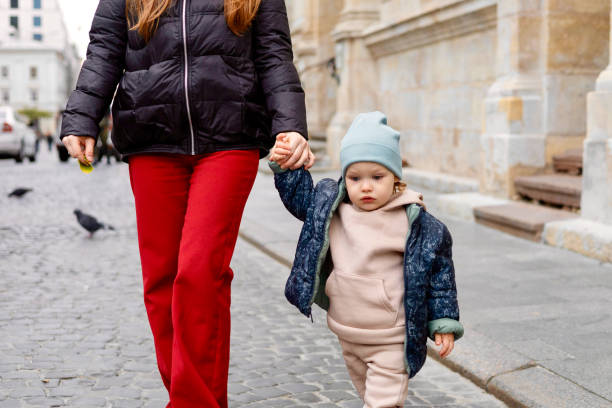 istock A young mother walks with her little son holding his hand 1782784490