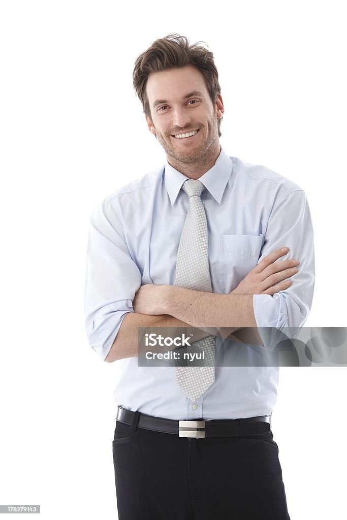 Empresario atractivo sonriendo con total confianza - Foto de stock de Hombres libre de derechos