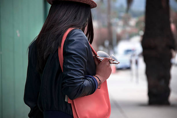 Girl with purse and glasses. stock photo