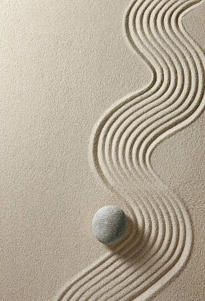 Zen stone Stone on sand background japanese rock garden stock pictures, royalty-free photos & images