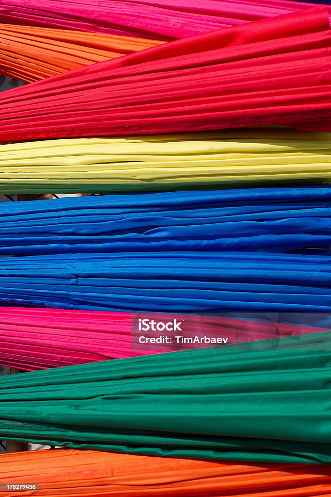 Multicolored umbrellas Background from closed multicolored umbrellas made in Bo Sang village, Chiang Mai province, Thailand Art And Craft Stock Photo