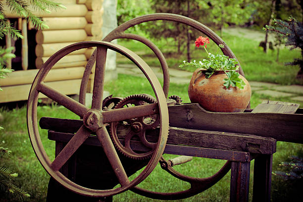 Close-up of an old wooden wagon wheel in the foreground.