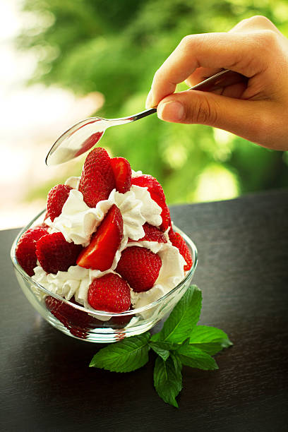 istock Reaching strawberrys with whipped cream 178280619
