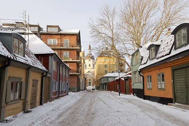 Winter in idyllic Sodermalm, Stockholm "Winter morning in idyllic Sodermalm, Stockholm, with snowy street and Katarina church in the background" sodermalm photos stock pictures, royalty-free photos & images