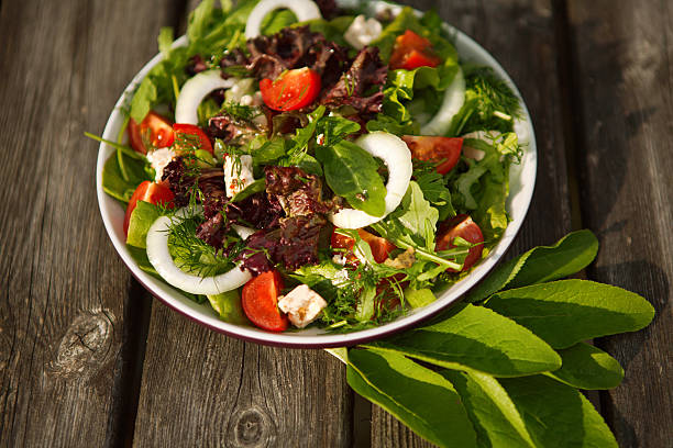 istock tomato and cucumber salad on a plate.. 178282875