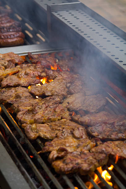 istock Sausages and pork in a smoke on barbecue 178283084