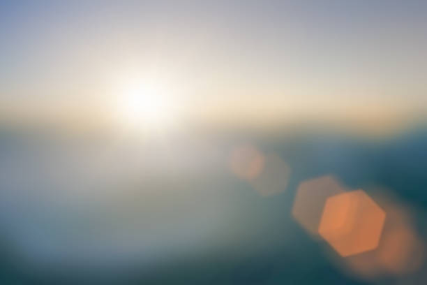 istock Natural background blurring warm colors and bright sun light. Bokeh or Christmas background Green Energy at sky sunny color orange light patterns plain abstract flare evening clouds blur. 1782846561