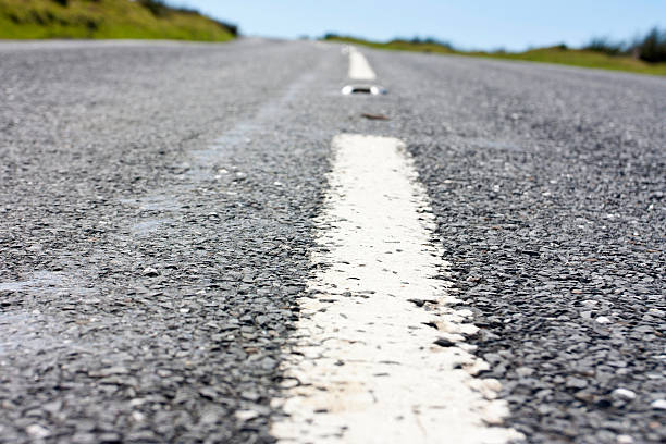 istock close up of the centre white line in a road 178287607