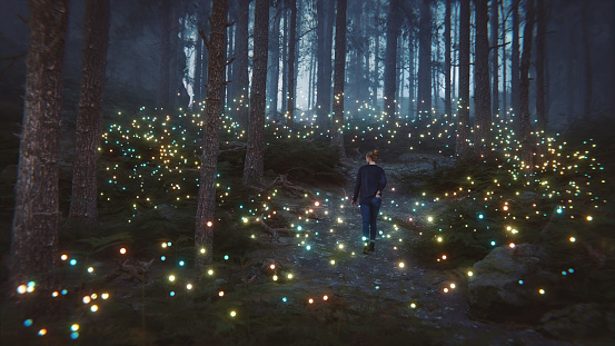 Young woman walking in fantasy forest